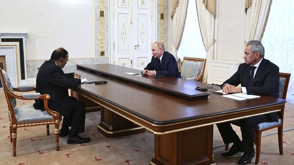 Russian President Vladimir Putin, center, accompanied by Russian Security Council Secretary Sergei Shoigu, right, speaks with Indian National Security Adviser Ajit Doval, left, on the sidelines of the BRICS and BRICS Plus High-Level Security Officials meeting in St. Petersburg, Russia, Thursday, Sept. 12, 2024. - Sputnik Türkiye