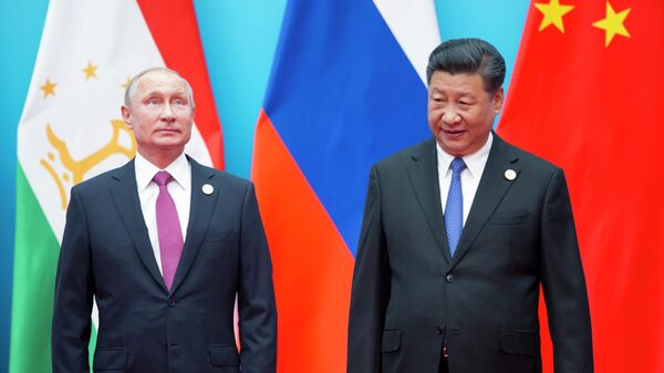 Vladímir Putin, presidente de Rusia, y Xi Jinping, presidente de China - Sputnik Mundo