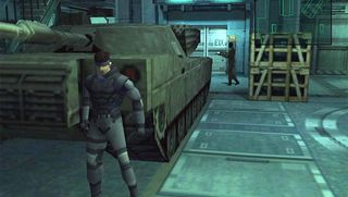 Best PS1 games – Metal Gear Solid screenshot of Snake hiding behind an tank.