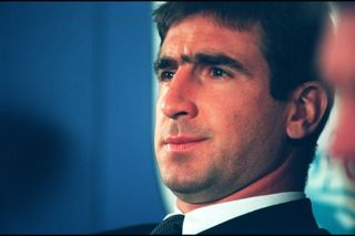 Eric Cantona is given a ban by the Football Association following his assault on a fan during a game for Manchester United against Crystal Palace in January 1995.