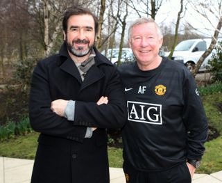 Eric Cantona poses with Sir Alex Ferguson on a visit to Manchester United's training ground in 2010.