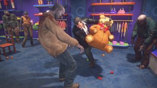 Frank West fighting a zombie with a teddy bear in Dead Rising Deluxe Remaster