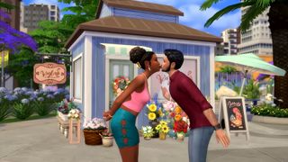 The SIms 4 Lovestruck expansion - two sims lean over to kiss lightly outside a neighborhood cafe