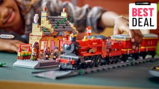 Lego Hogwarts Express set being played with by a child, while the Hogsmeade Station kit sits in the background