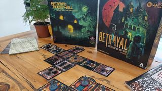 Betrayal at House on the Hill third edition vs second edition on a wooden table