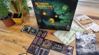 Betrayal at House on the Hill 2nd edition box and board on a wooden table