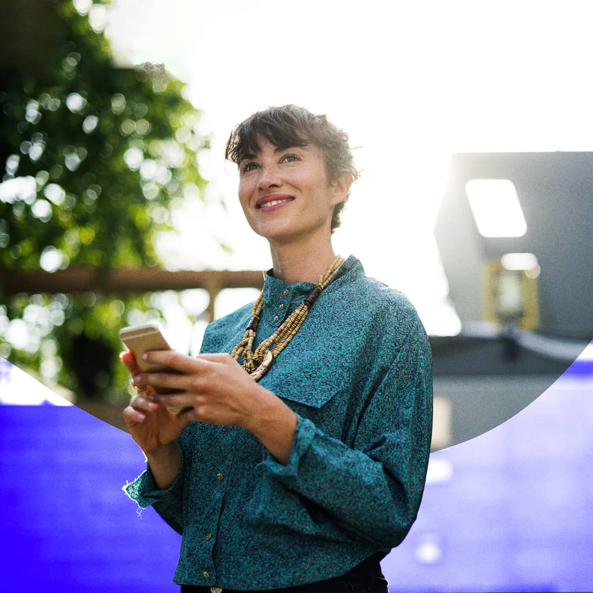 Woman smiling with smartphone