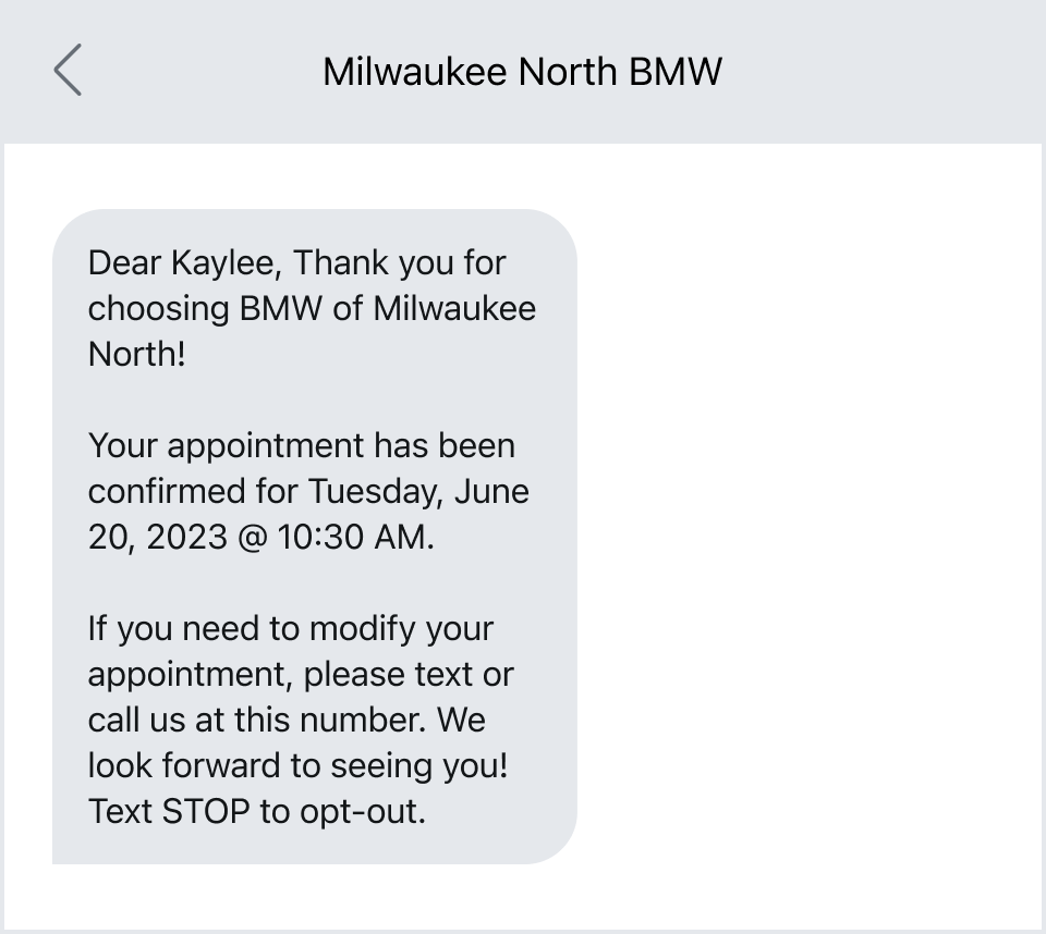 A service reminder text from BMW.