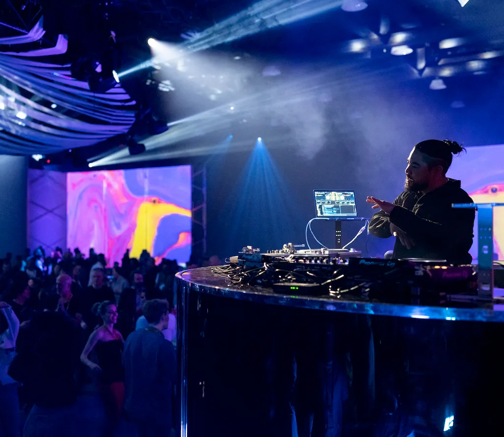 A DJ plays music during the TED welcome party.