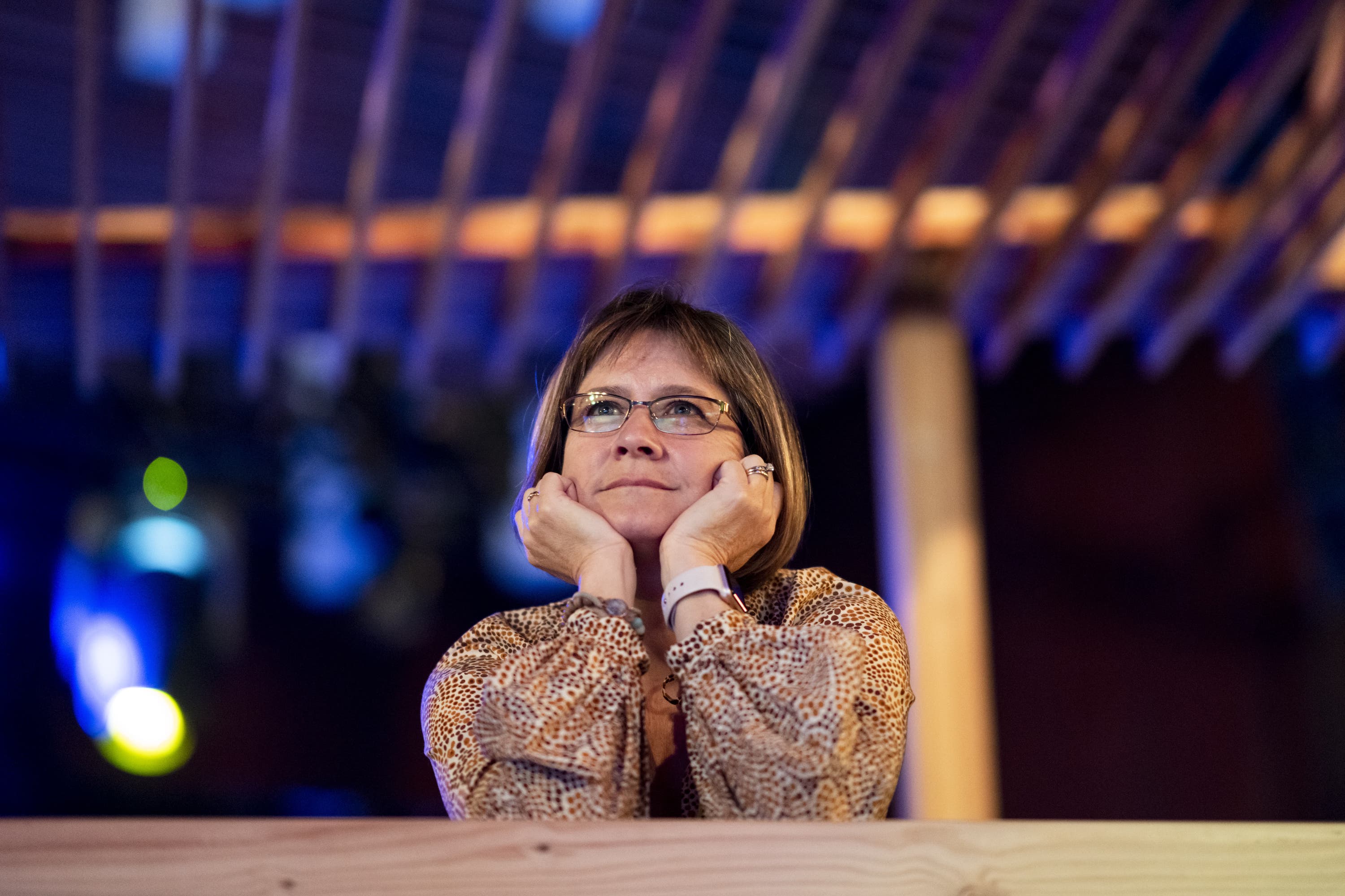 A TED attendee listens intently to a TED Talk.