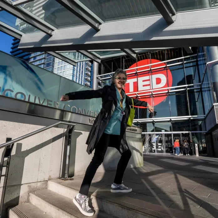 Person running on stairs at TED