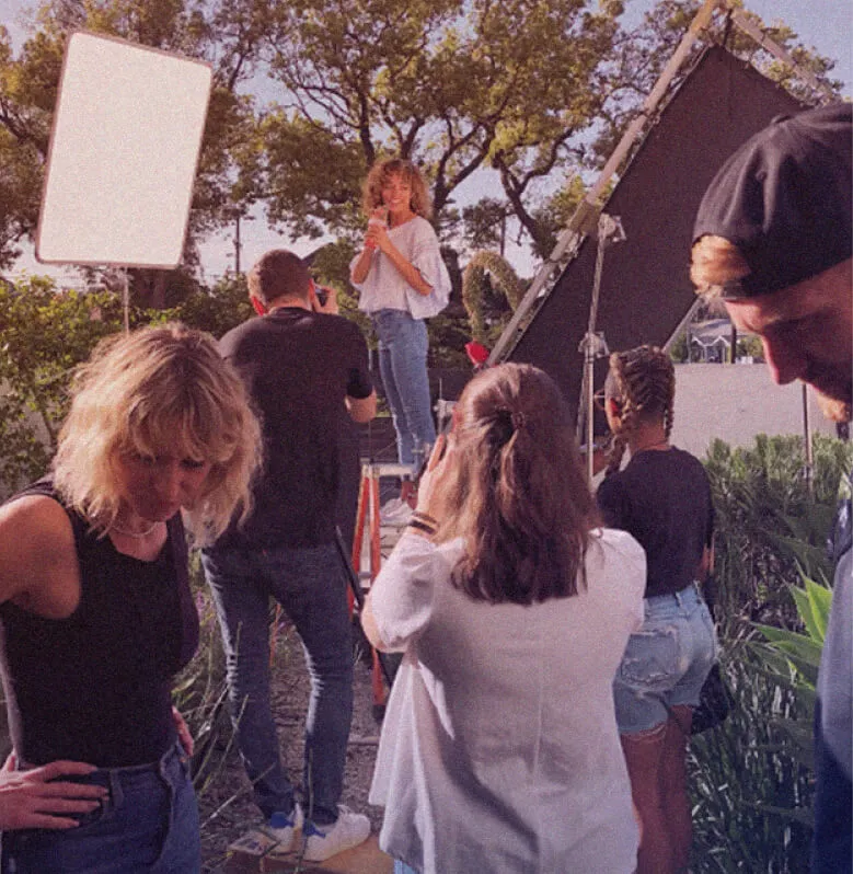 A group of people standing around each other