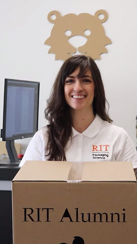 Diana Solt holding a cardboard box.