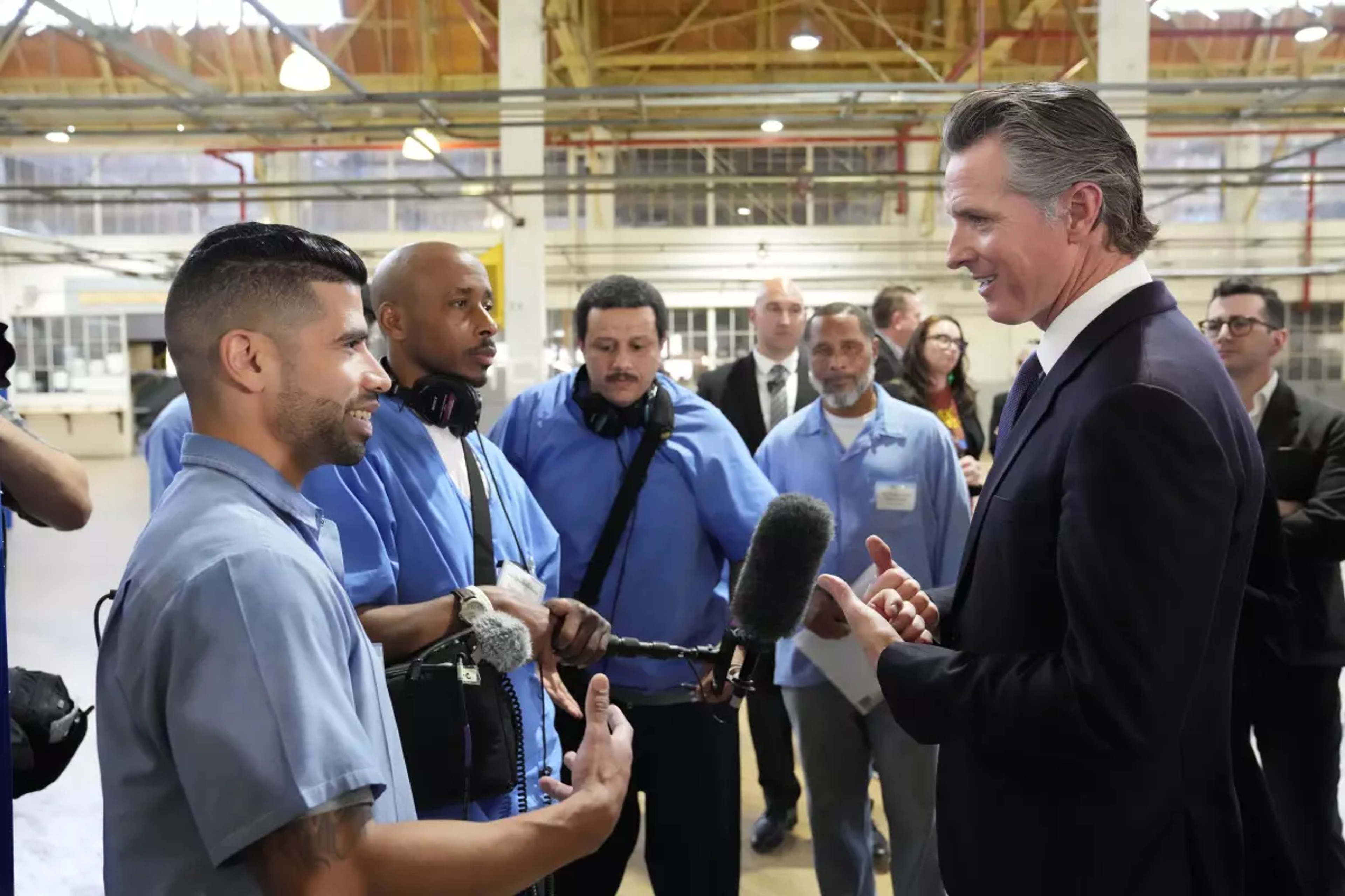 Governor Newsom speaking with inmates