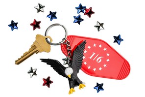 A keychain with a tag reading '1/6' and a miniature bald eagle.