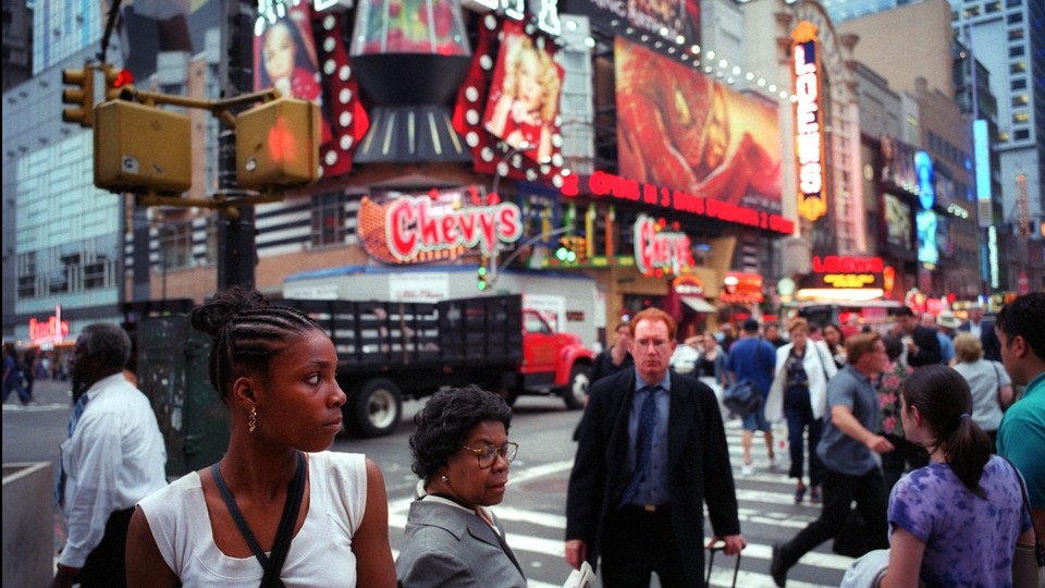 An old photo of Times Square filled with people