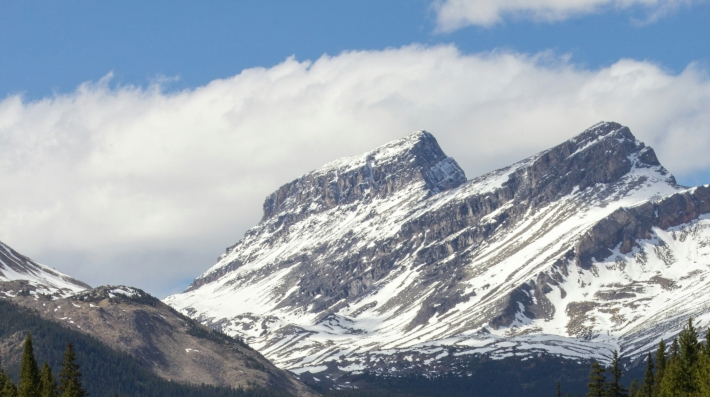 View of road with mountains on the horizon