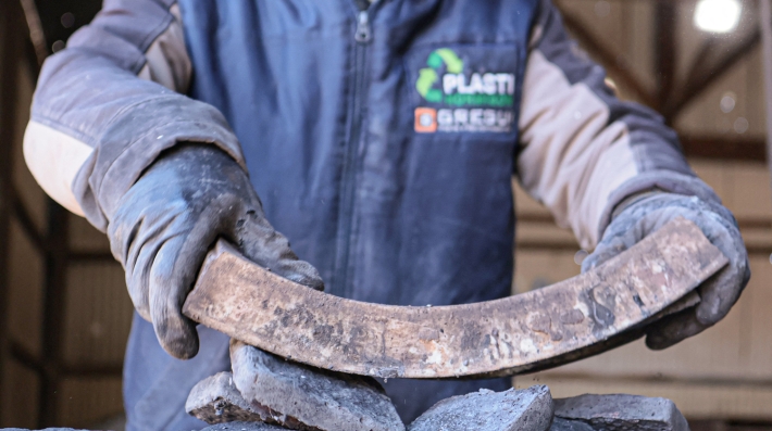 A man holding plastic brick