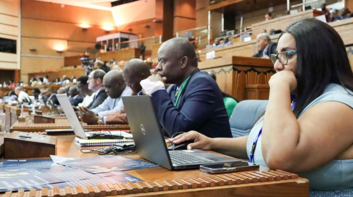 People at a meeting using their laptops