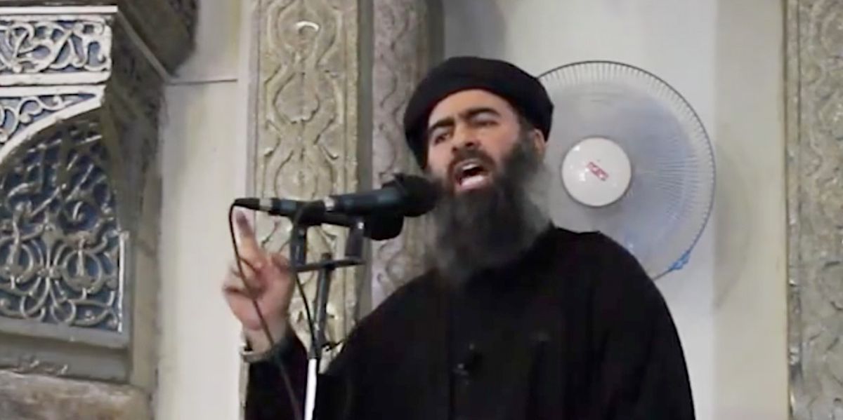 This image made from video posted on a militant website Saturday, July 5, 2014, which has been authenticated based on its contents and other AP reporting, purports to show the leader of the Islamic State group, Abu Bakr al-Baghdadi, delivering a sermon at a mosque in Iraq. A video posted online Saturday purports to show the leader of the Islamic State extremist group that has overrun much of Syria and Iraq delivering a sermon at a mosque in Iraq, in what would be a rare - if not the first - public appearance by the shadowy militant. (AP Photo/Militant video)