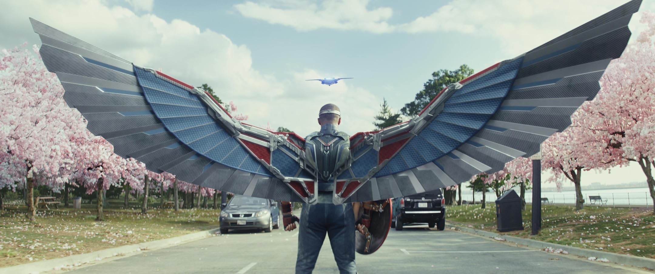 Sam Wilson/Captain America extends his Falcon flight suit wings as he prepares to pursue a jet in a still from the Captain America: Brave New World teaser trailer