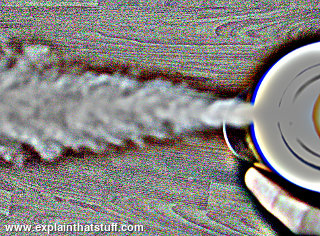 Aerosol can generating a blast of aerosol mist (retinex filtered)