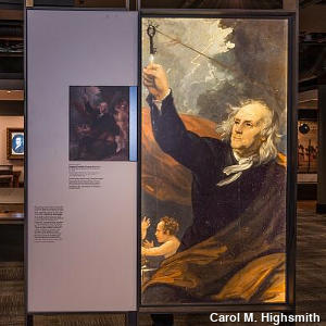 A museum exhibit illustrating Benjamin Franklin's flying a kite in a storm to catch electricity.