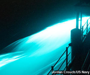 Bright blue bioluminescence photographed off the side of a ship in the East China Sea.