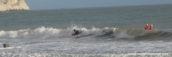 Bodyboarding at low tide with small sea swell