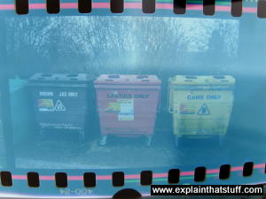 A 35mm film positive of recycling dumpsters.