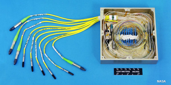 A fiber optic cable box showing the cables bent around in a loop.