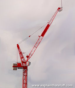 Red luffing tower crane.