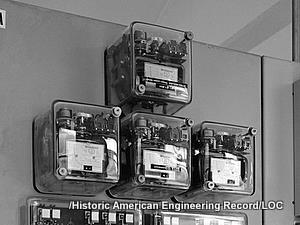 A bank of four overcurrent protection relays in glass boxes at Bonneville Power Administration South Bank Substation, Bonneville, Multnomah County, OR.