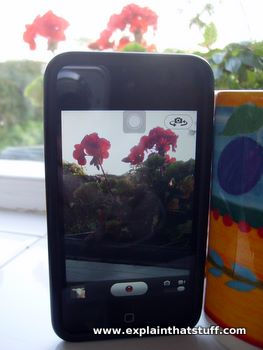 A smartphone video camera propped up to act as a home security monitor.