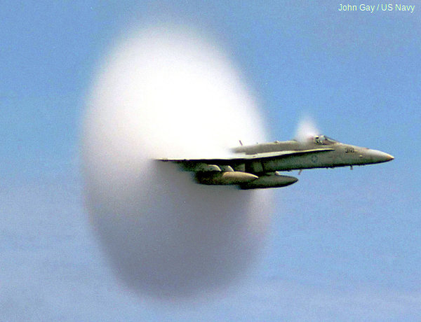 Jet airplane: Condensation cloud created by a fighter jet.