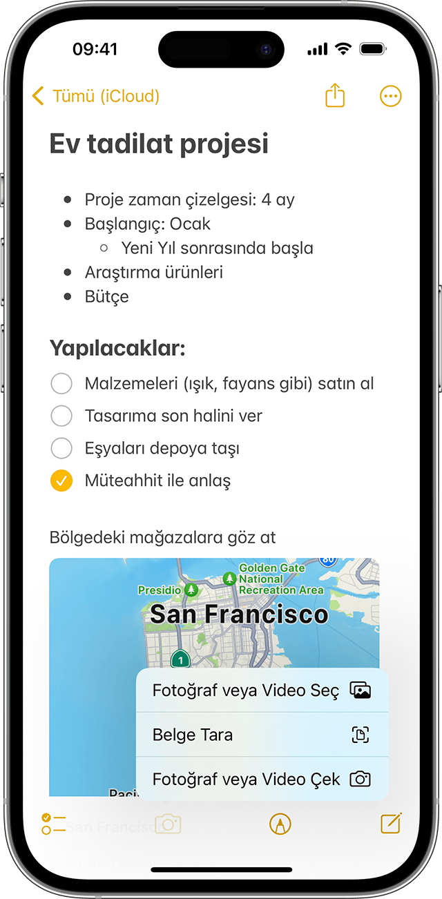 Notlar uygulamasında bir nota nasıl fotoğraf veya video ekleneceğini gösteren iPhone.
