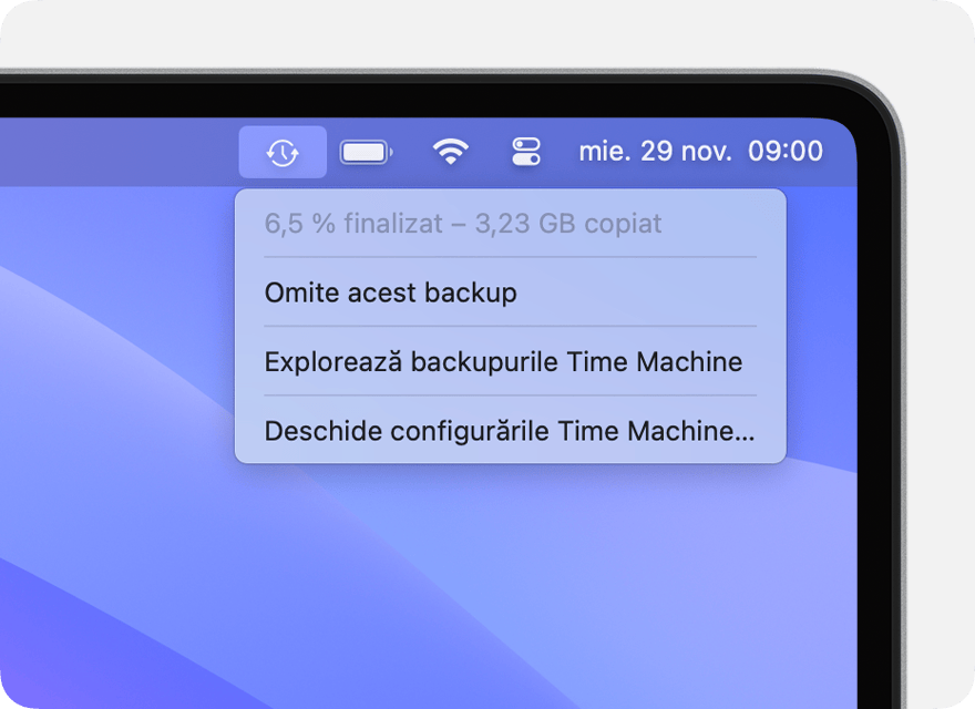 Meniul Time Machine care afișează un backup în curs