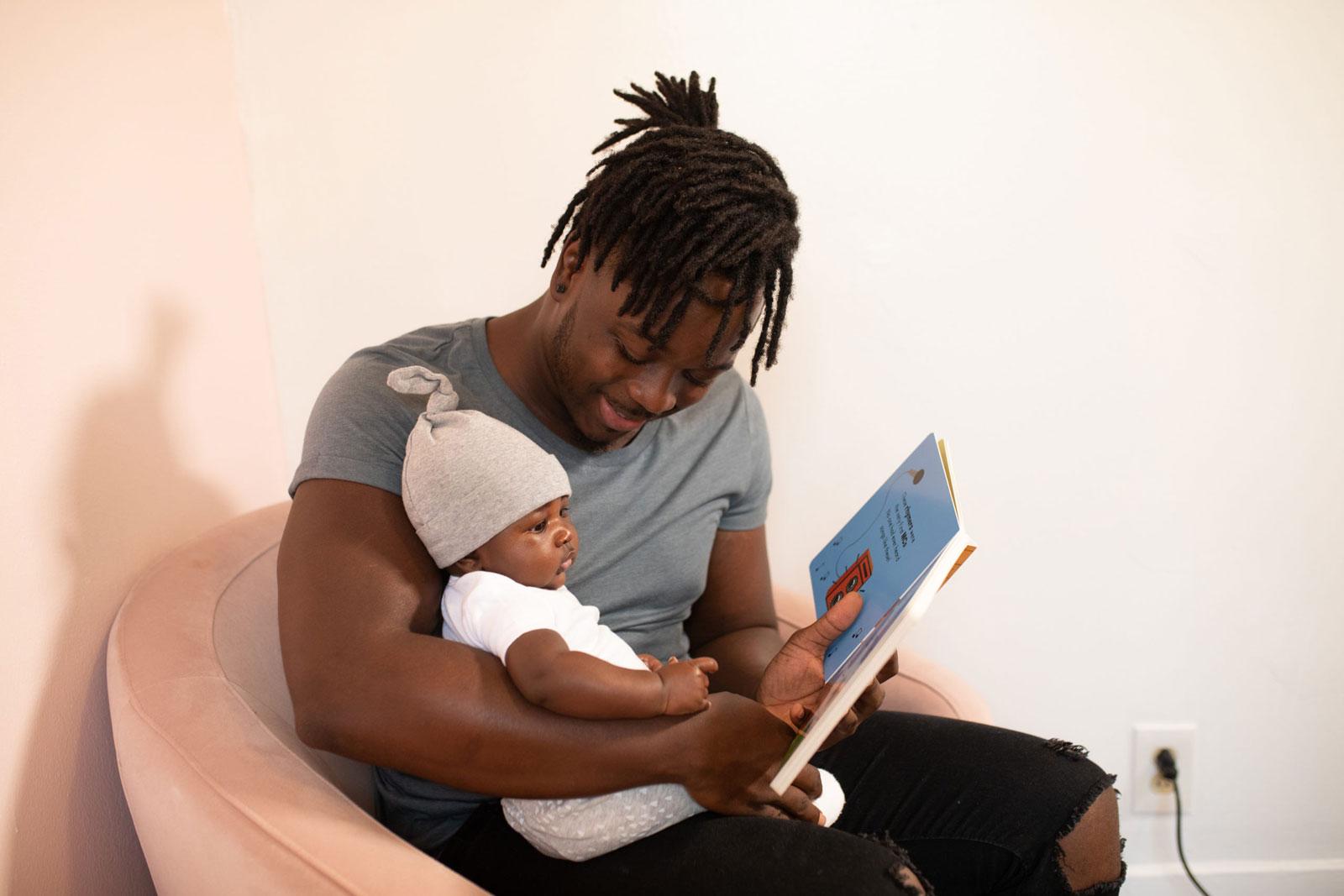 Father and daughter reading together