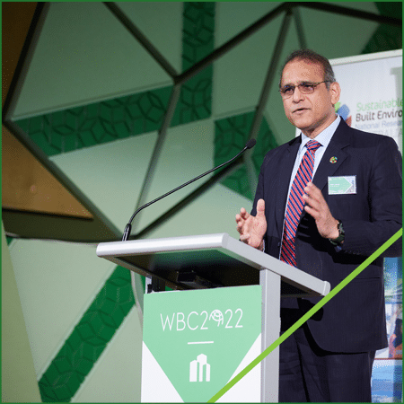 Makarand Hastak speaking at podium