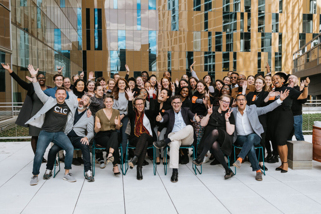 Group photo of CIC staff on the terrace celebrating an event