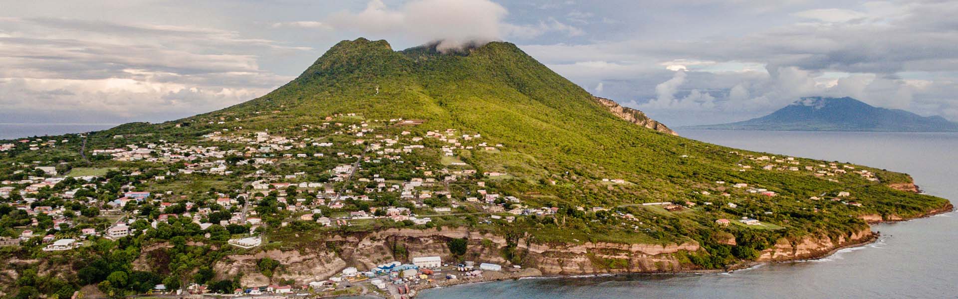 coastal landscape with green mountains