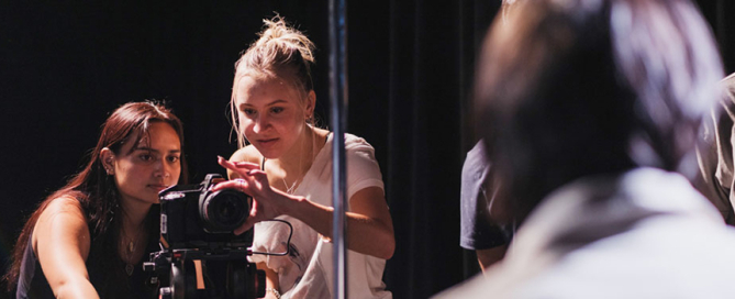 Jordelle Beja, a sophomore studying motion pictures, and junior Paula Romanowski film a music video of freshman Dawson Fuss, who is studying modern artist development entrepreneurship at the Frost School of Music. Photo: Cameron Tavokoly/School of Communication