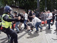 MANCHESTER, ENGLAND - AUGUST 3: Police clash with right wing protesters in Piccadilly Gardens on August 3, 2024 in Manchester, United Kingdom. Mis-information spread on social media after the murders of three girls in Southport earlier this week has fueled acts of violent rioting from far-right sympathisers across England. (Photo by Christopher Furlong/Getty Images)