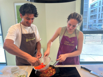 After instruction from the L’Atelier Gourmand chef, second-year Chemical Engineering major Juan Pablo Gonzalez-Villaseca and second-year Biomedical Engineering major Alexis Vladescu prepare a Basque-style wok chicken for their entrée.