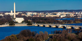 Washington D.C. . - Aerial view of Washington D.C. from Top of Town restaurant, Arlington, Virginia shows Lincoln & Washington Memorial and U.S. Capitol with tour boat and Potomac River in foreground