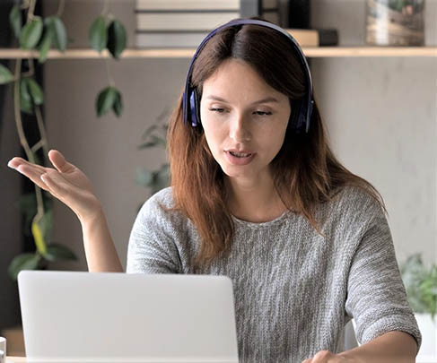 CX security webinar a woman headphone at a laptop