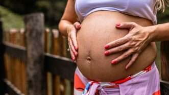 A pregnant woman holding her stomach | Photo by <a href="https://unsplash.com/@azevdoluana?utm_content=creditCopyText&utm_medium=referral&utm_source=unsplash">Luana Azevedo</a> on <a href="https://unsplash.com/photos/a-pregnant-woman-with-her-hands-on-her-stomach-Mj1aVYsJIiM?utm_content=creditCopyText&utm_medium=referral&utm_source=unsplash">Unsplash</a>   