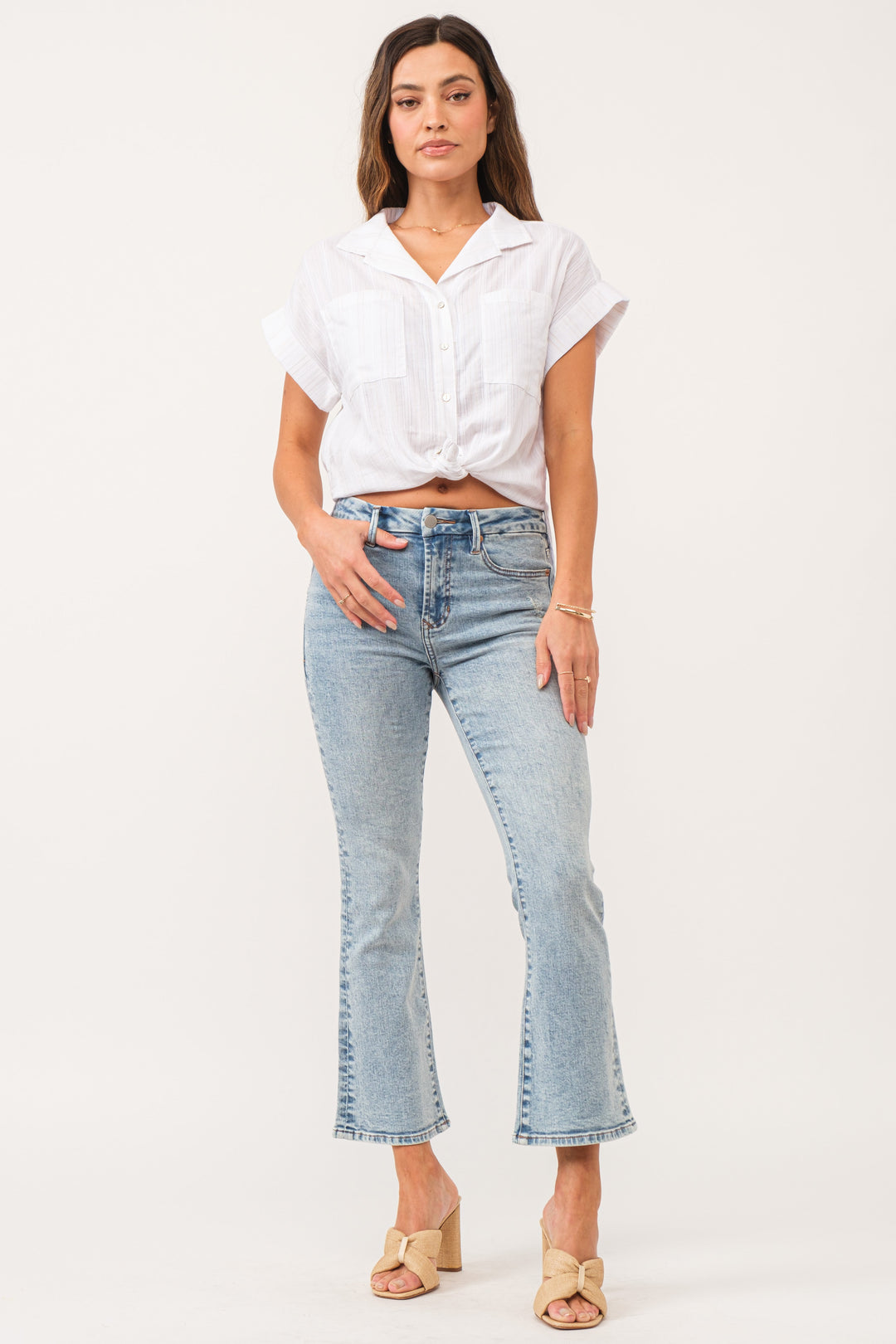 image of a female model wearing a JEANNE HIGH RISE CROPPED FLARE JEANS WEZLEY DEAR JOHN DENIM 