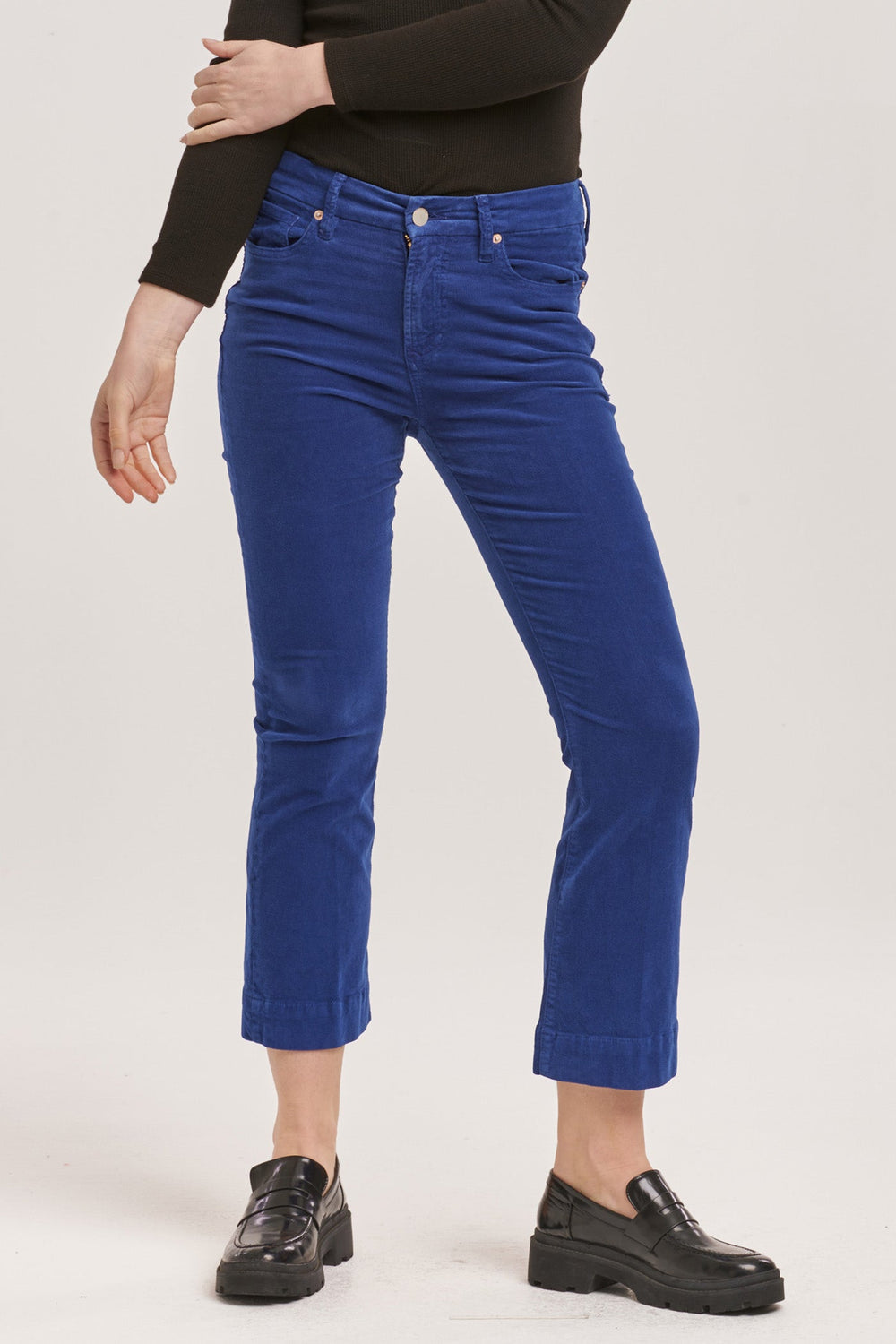 image of a female model wearing a JEANNE MID RISE CROPPED FLARE PANTS ROYAL BLUE CORDUROY DEAR JOHN DENIM 