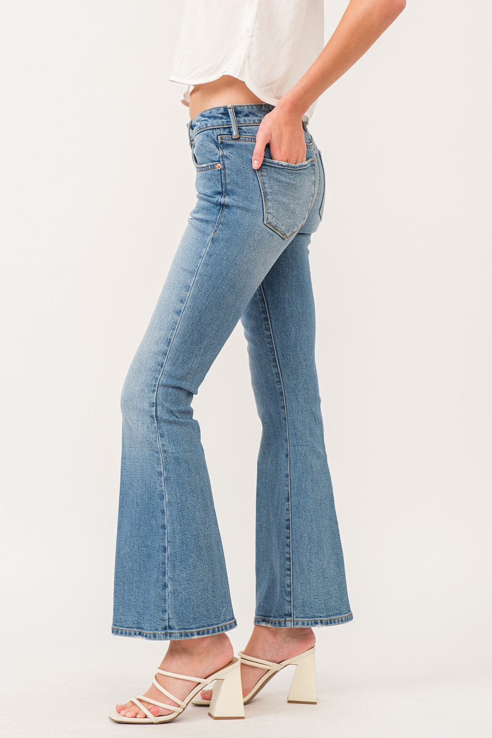 image of a female model wearing a ROSIE LOW RISE FLARE JEANS COLLISTER DEAR JOHN DENIM 